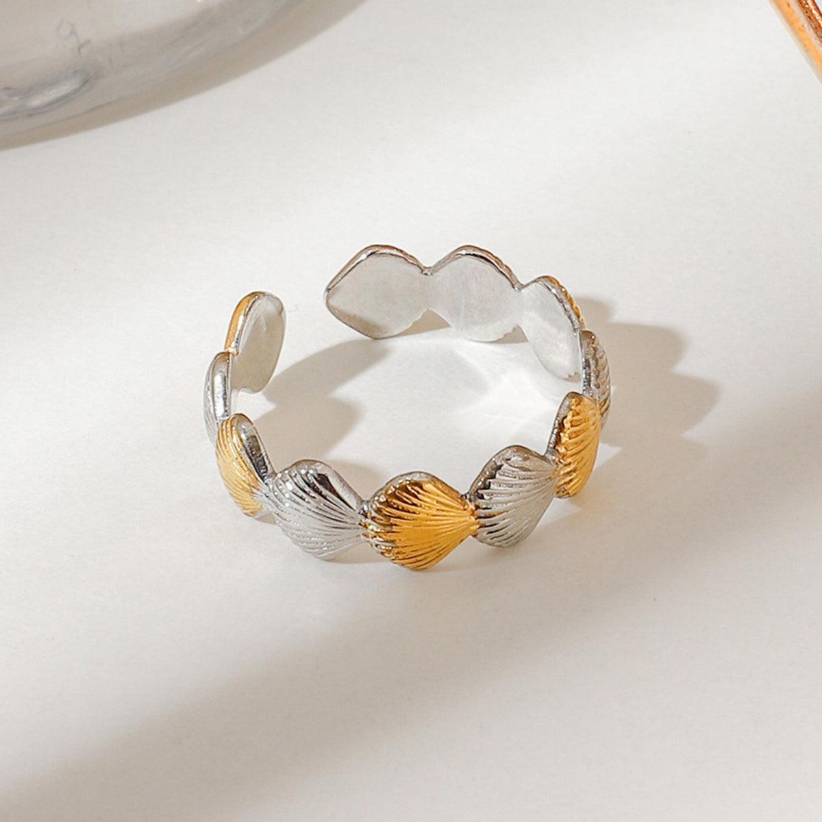 Seashell ring gold silver – detail on light background
