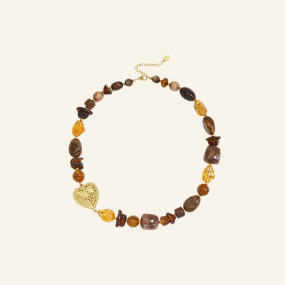 Beaded heart necklace – brown on beige background