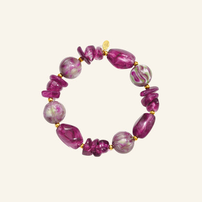 Purple marbled beaded bracelet – on beige background