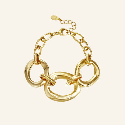 Gold round link bracelet – on beige background