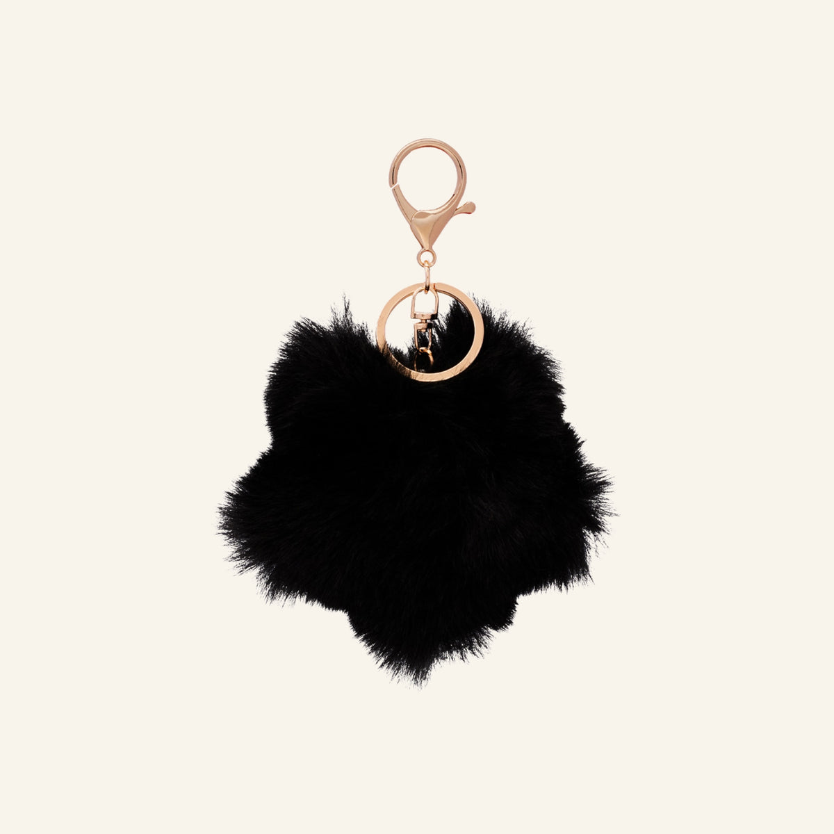 Fluffy flower bag charm – black, on beige background