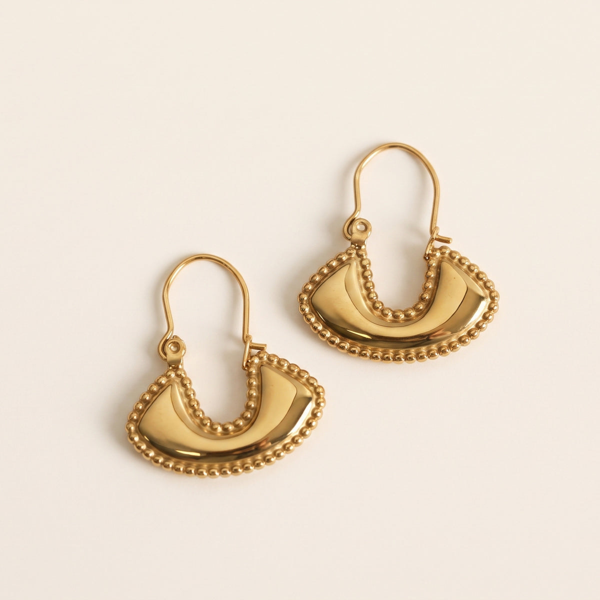 Boho fan earrings gold – on beige background