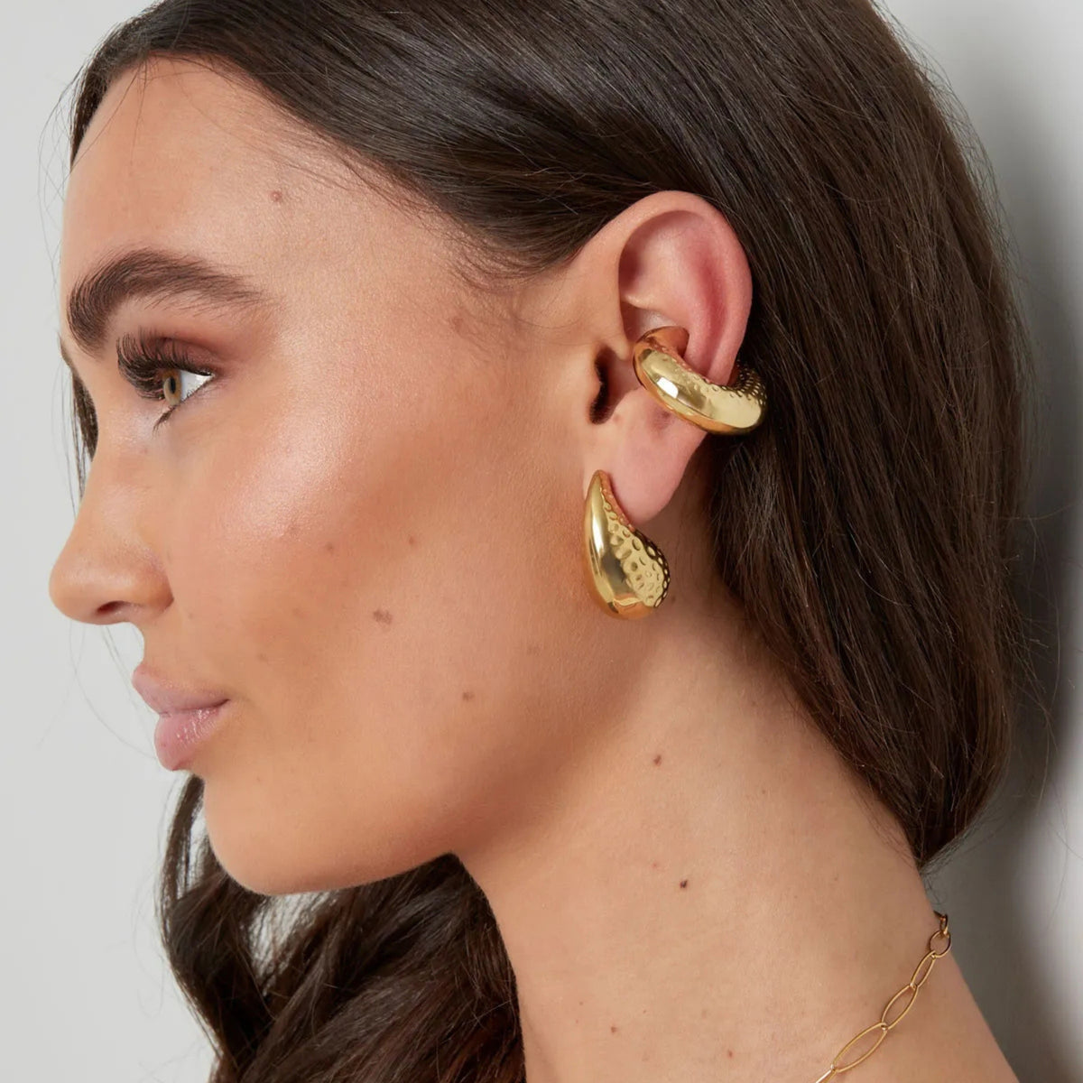Gold hammered ear cuff – worn on the ear