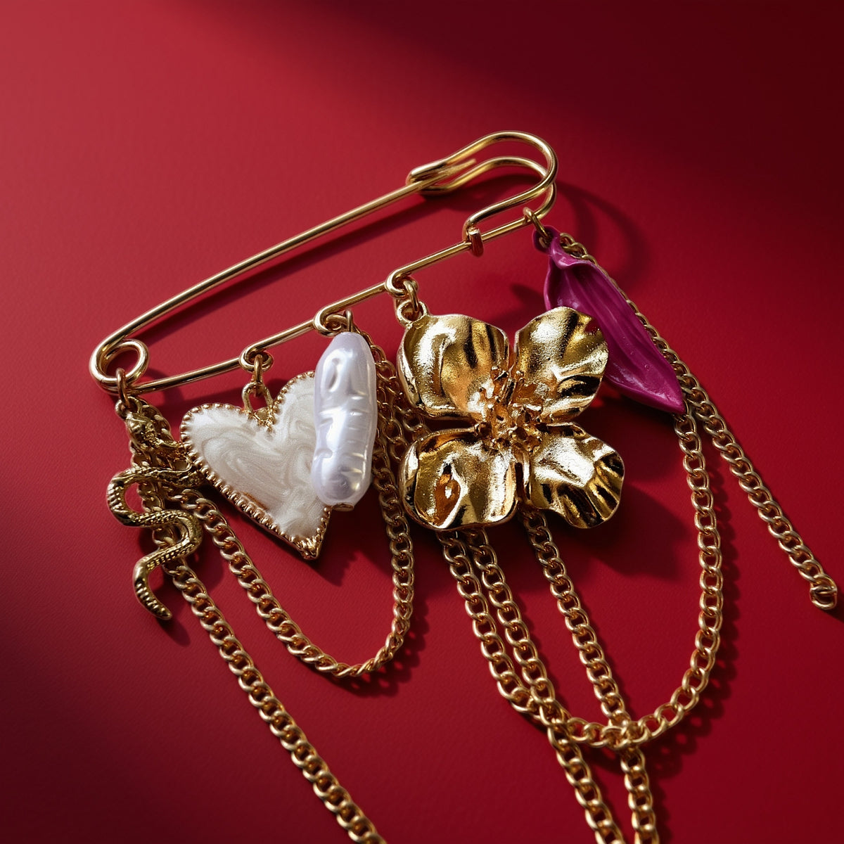 Bloem hart slang broche goud roze detail