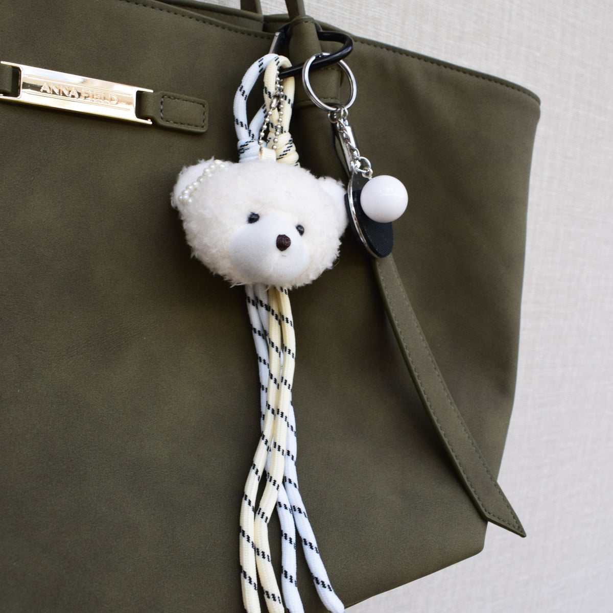 Teddy sports bag charm, worn on a bag
