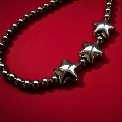 Star beads bag charm, close-up on red