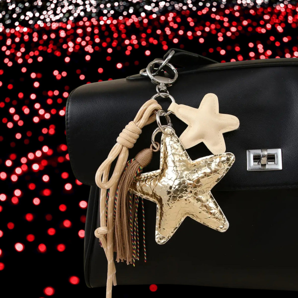 Ster bag charm met franjes goud aan tas