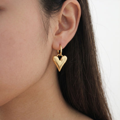 Gold heart hoop earrings – worn, second photo