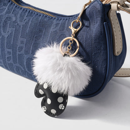 Handschoen polka dots fluffy bag charm aan denim tas