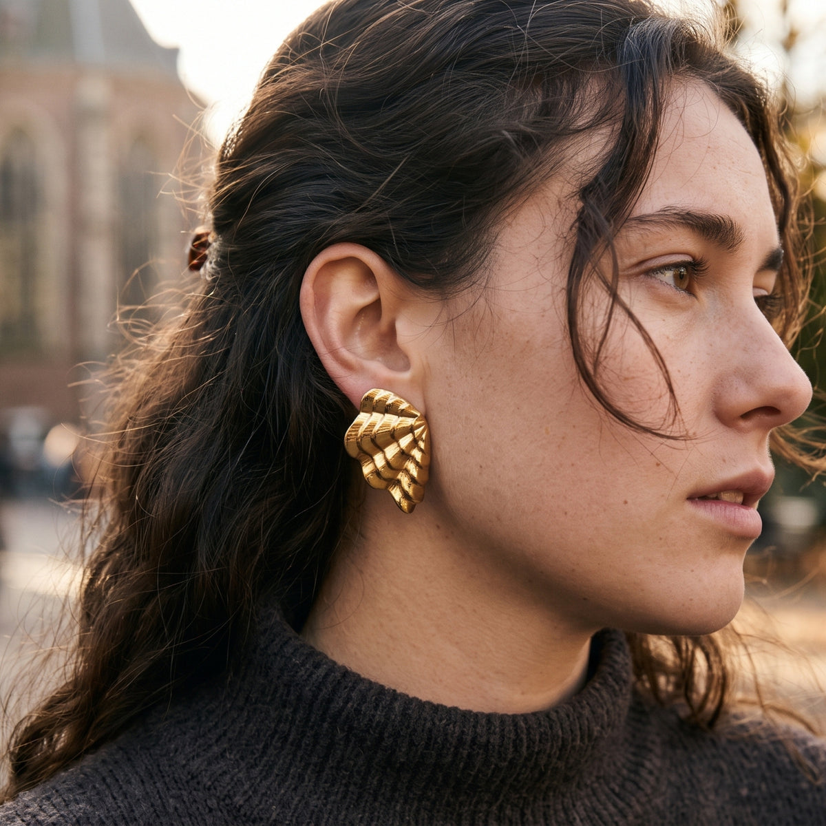 Gold shell earrings – worn, side view