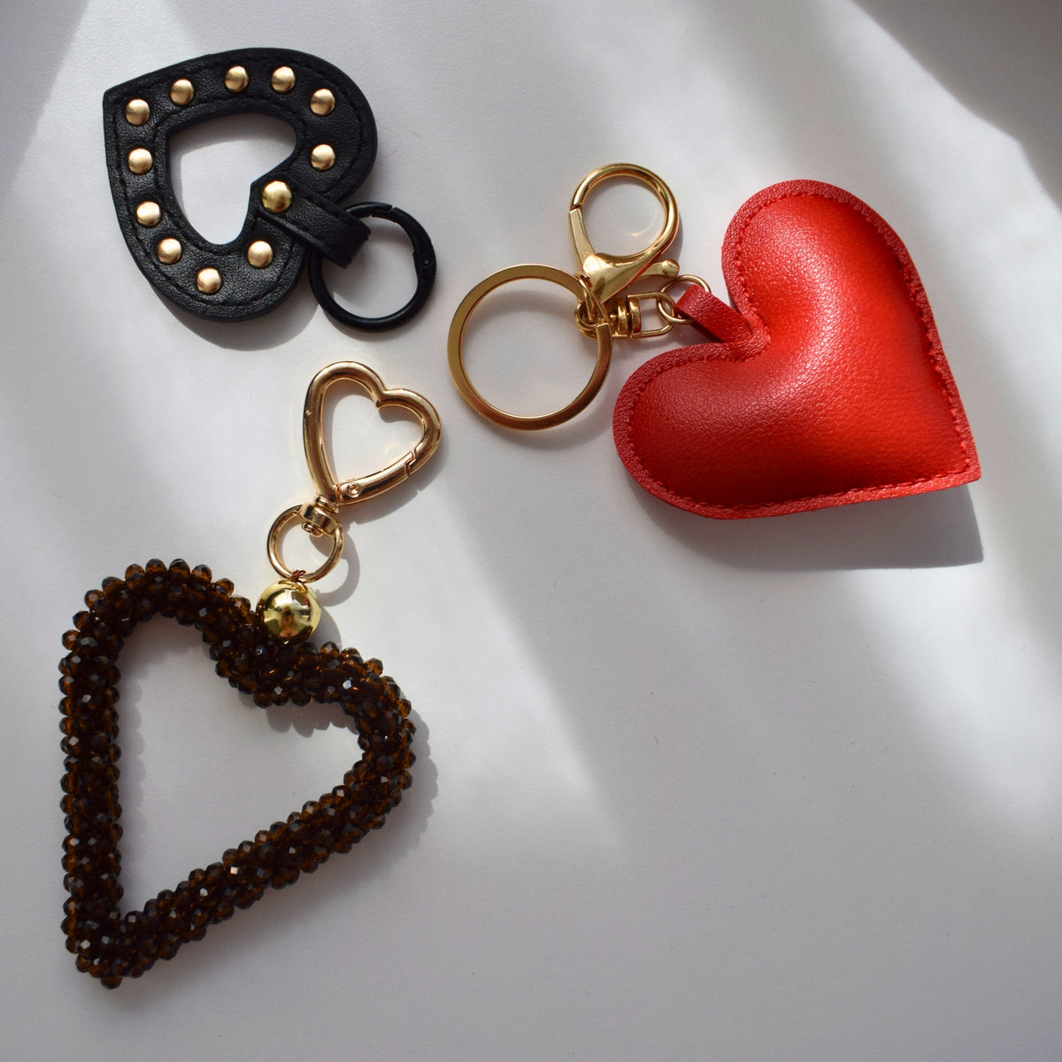 Hart studs bag charm zwart met andere bag charms