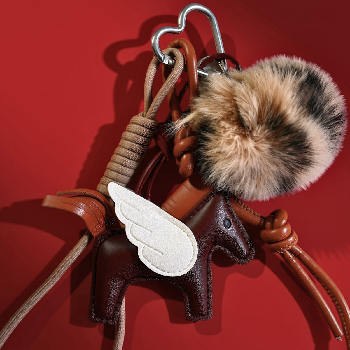 Pegasus bag charm brown on a bag