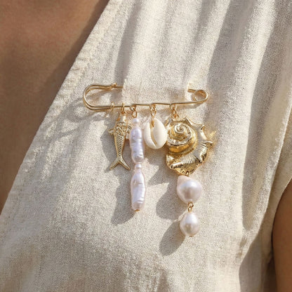 Schelp vis parel broche goud wit