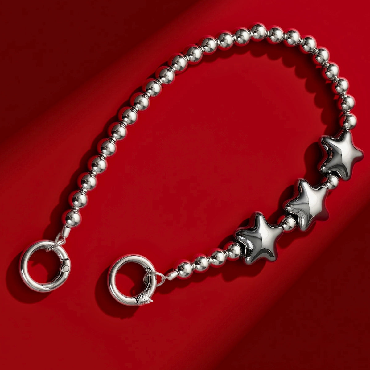 Star beads bag charm on red background