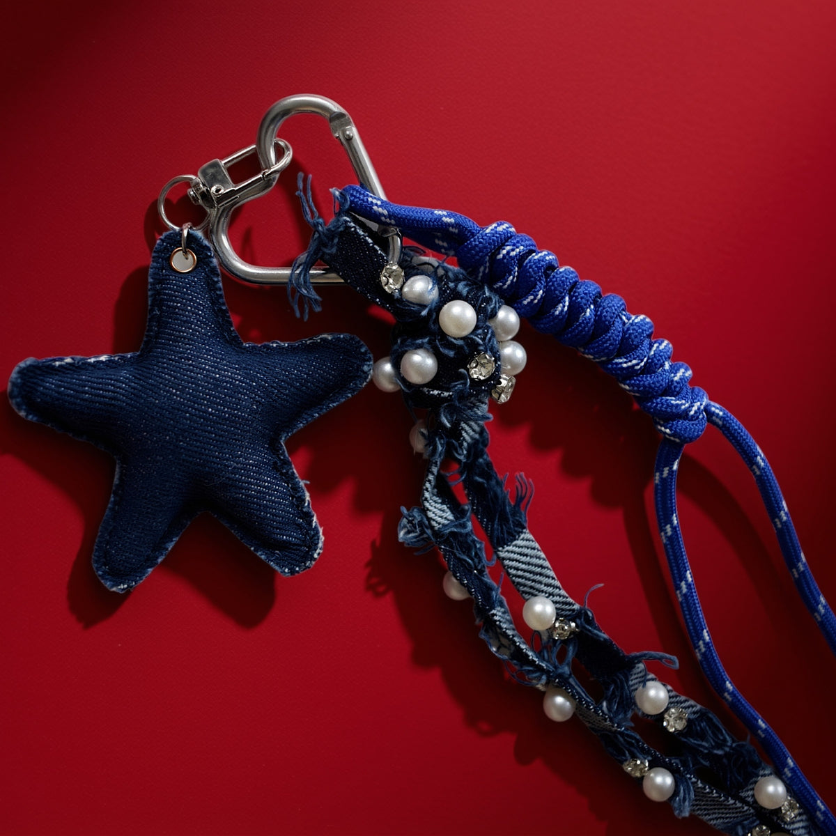 Ster van stof bag charm blauw