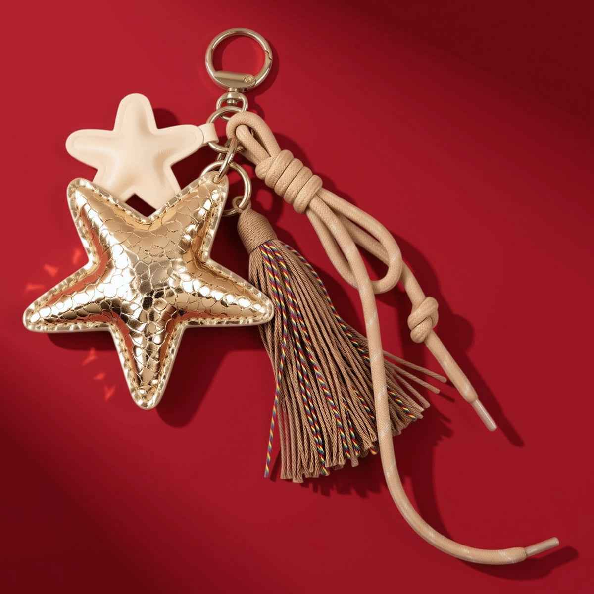 Ster bag charm met franjes goud