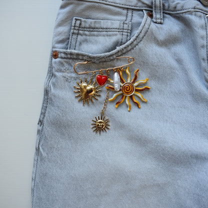 Zon en hart broche goud rood met bedels