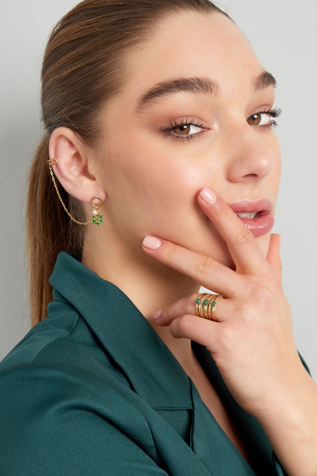 Flower earring with ear cuff, worn – model wearing green