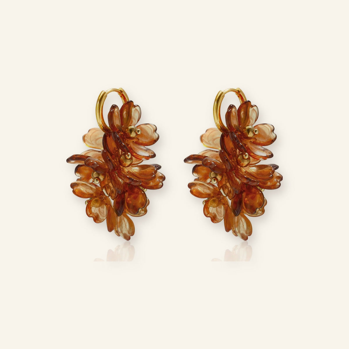 Brown flower cluster earrings – on beige background