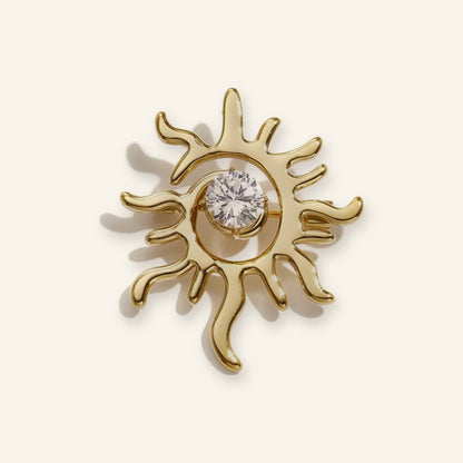 Zon broche goud – vrijstaand op beige