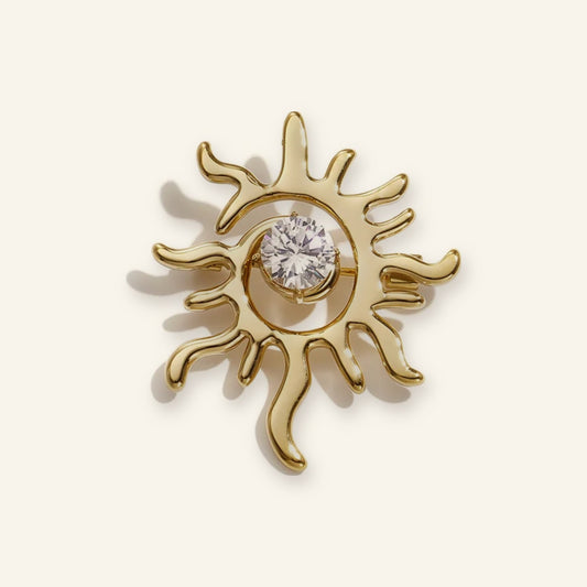 Zon broche goud – vrijstaand op beige